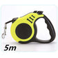 Pet automatic telescopic traction rope in black and yellow, suitable for pets, 5 meters long, features a one-handed control system.